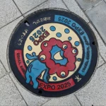 ２０２５年日本国際博覧会協会 道修町オフィス周辺（大阪市中央区道修町3丁目付近）（大阪・関西万博デザインマンホール）